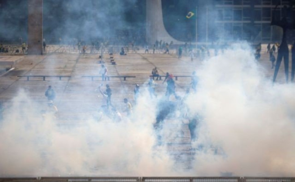 Smoke is pictured as supporters of Brazil's former President Jair Bolsonaro demonstrate against President Luiz Inacio Lula da Silva in Brasilia, Brazil, December 8, 2023. REUTERS/Adriano Machado