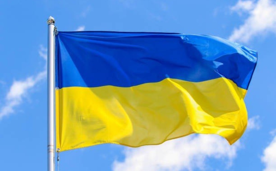 Flag of Ukraine on a background of blue sky