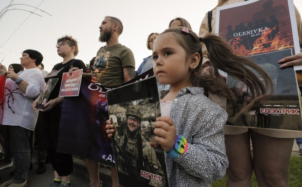 epa10776122 Relatives and friends of the defenders of the Azovstal Iron and Steel Works attend a ceremony to remember the victims of the Olenivka camp explosion one year on, as they gathered near the Russian embassy building in Kyiv, Ukraine, 29 July 2023