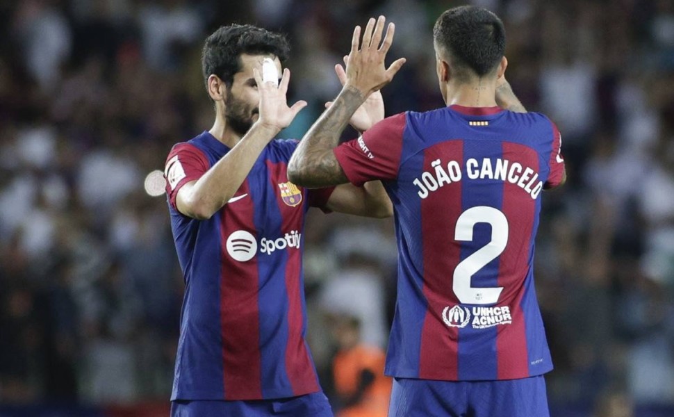 epa10879441 FC Barcelona's midfielder Ilkay Gundogan (L) and defender Joao Cancelo (R) celebrate their victory following the Spanish LaLiga soccer match between FC Barcelona and RC Celta Vigo, in Barcelona, Spain, 23 September 2023.  EPA/Quique García