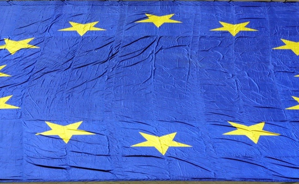 MTZ04 - 20010509 - STRASBOURG, BAS RHIN, FRANCE : A cyclist rides 09 May 2001- Europe's day - near a 600 m2 European flag in front of Robert Schumann university in Strasbourg.

EPA PHOTO AFP/DAMIEN MEYER