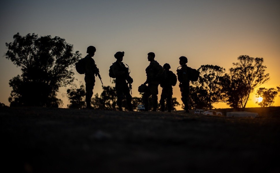 epa10915265 Israeli soldiers patrol the area of an attack that killed more than 260 people at a music festival on 07 October, near Raim, Israel, 12 October 2023. More than 1,200 Israelis have been killed and over 3,000 others injured, according to the Isr