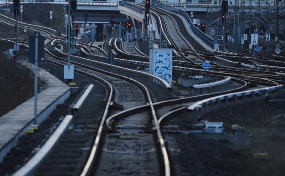 Railroad signals turned to red near the tracks in Berlin, Germany, Monday, March 27, 2023, during a national wide public transport strike. An increased number of travelers in Germany boarded trains and planes on Sunday before the one-day strike that start