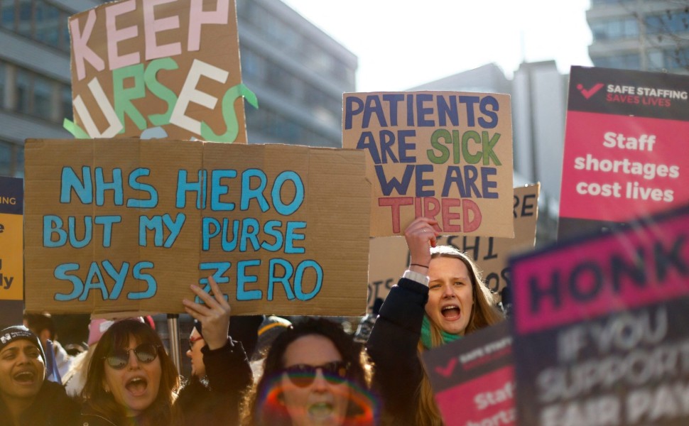 Nurses protest during a strike by NHS medical workers, amid a dispute with the government over pay, outside St Thomas' Hospital, in London, Britain, February 6, 2023. REUTERS/Peter Nicholls