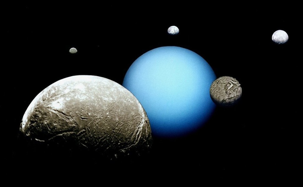 Uranus and its five major moons are depicted in this montage of images acquired by the Voyager 2 spacecraft. Miranda is the second largest moon in the photo. Credit: NASA/JPL, Public domain, via Wikimedia Commons.